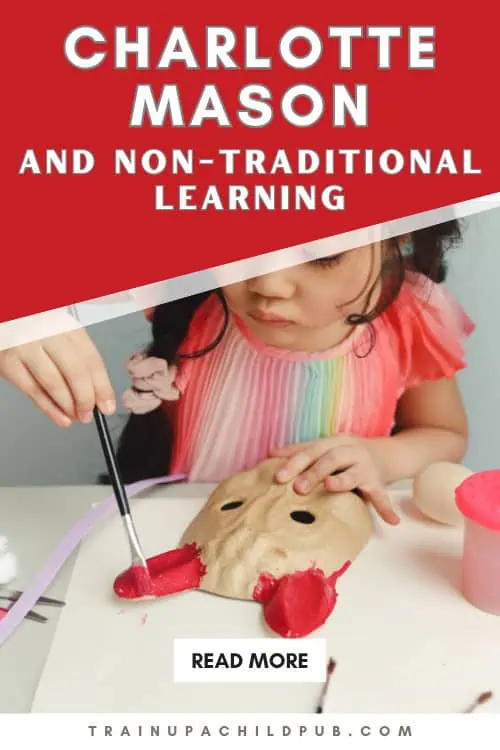 Young homeschooled girl painting a clay mask red for a homeschool lesson.