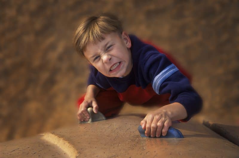 determined boy climbing up wall -- teaching character using poetry